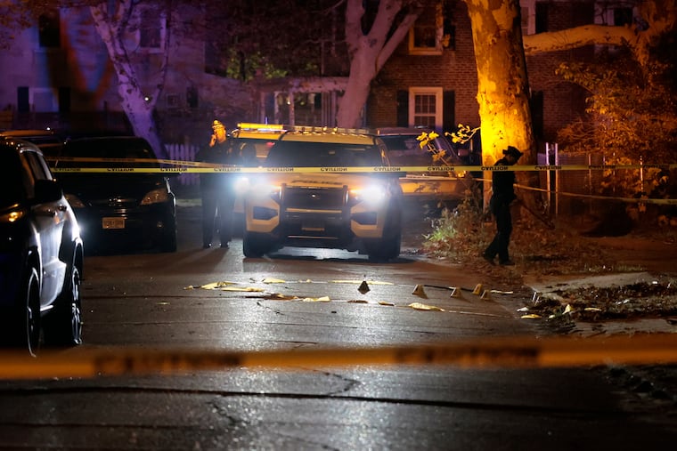 Police process the crime scene on North Congress Road in Camden early Wednesday morning where a Camden County police officer was shot late Tuesday night.