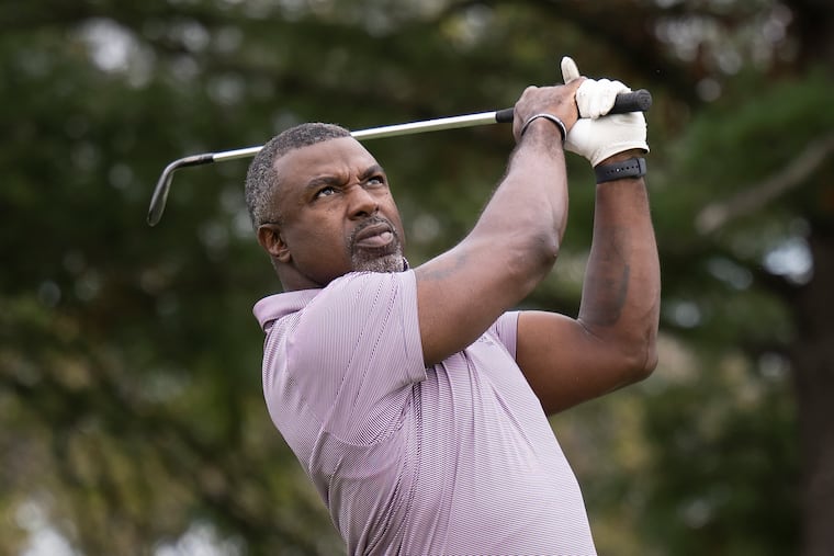 Former Eagles star Brian Westbrook tees off during his annual charity golf outing Tuesday at the Union League Golf Club in Lafayette Hill.