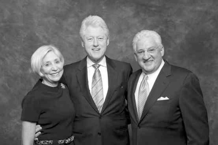Leonard Barrack, president of the Jewish Federation of Philadelphia, with his wife, Lynne, and former President Bill Clinton, who was the guest speaker. The event drew more than 750 guests and raised $3.5 million.