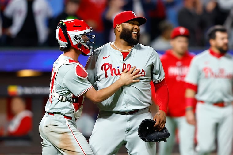 José Alvarado (right) picked up the save in the Phillies' comeback win over Mets.