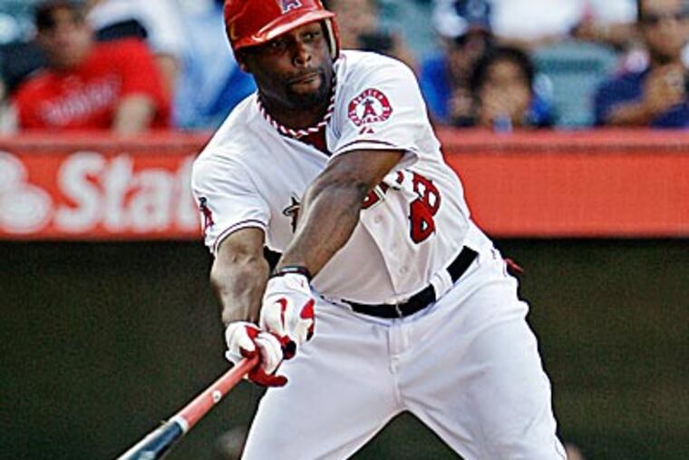 The Angels' Torii Hunter strikes out in the bottom of the ninth inning against the Mariners. (Reed Saxon/AP)