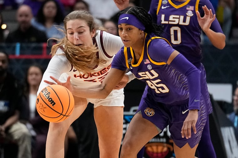 Virginia Tech's Elizabeth Kitley and LSU's Alexis Morris go after a loose ball during the first half of their NCAA Women's Final Four semifinal game on Friday in Dallas.