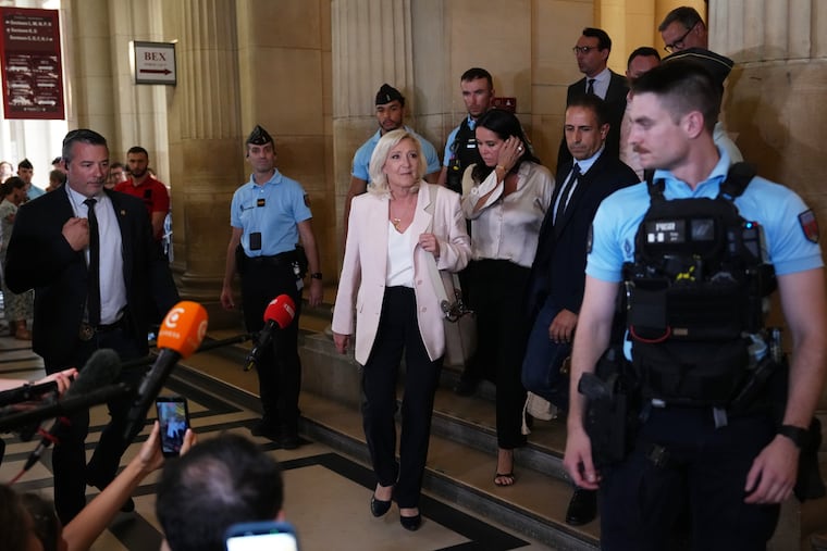Far-right leader Marine Le Pen leaves the courtroom after the verdict of her appeal trial, in Paris, France, Tuesday, July. 7, 2026.