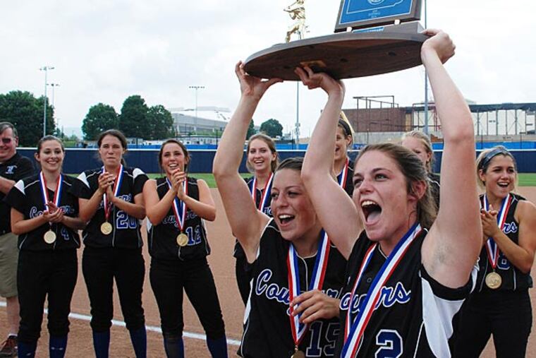 Springfield Delco's Lauren Scarpato (15), left, and Courtney Scarpato
(2) hold up the trophy after their 3-0 win over Bethlehem Catholic in
the PIAA Class AAA Softball Championship on June 13, 2014. Photo/Craig
Houtz