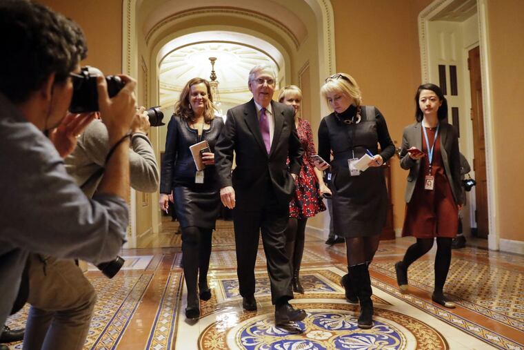 Senate Majority Leader Mitch McConnell of Ky., walks back to his office on Capitol Hill in Washington, Monday, Jan. 22, 2018.