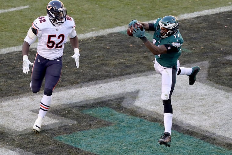 Eagles’ Alshon Jeffery, right, catches a 2nd quarter touchdown pass in front of the Bears’ Christian Jones, left. Philadelphia Eagles win 31-3 over the Chicago Bears in Philadelphia, PA on November 26, 2017. DAVID MAIALETTI / Staff Photographer