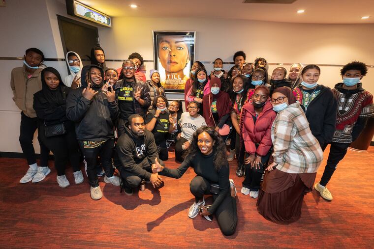 High school students from the Sankofa Freedom Academy and Inquirer columnist Jenice Armstrong pose for a photo prior to a screening of the new film "Till," which tells the story of Emmett Till, at the PFS Bourse Theater in Philadelphia, Tuesday, Oct. 18, 2022. The movie opens to the general public on Friday.