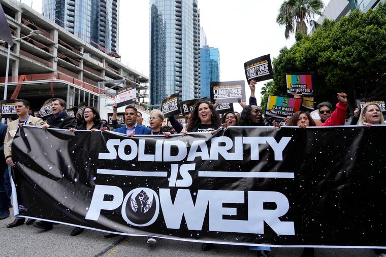 Union members march through downtown Los Angeles at the "Unions Strike Back" rally, Friday, May 26, 2023.