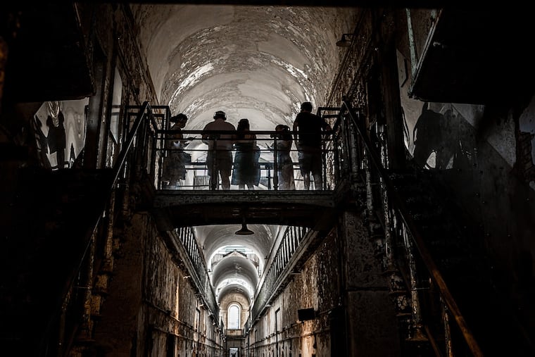Guests exploring Eastern State Penitentiary during the former prison's Halloween Nights haunted attraction.