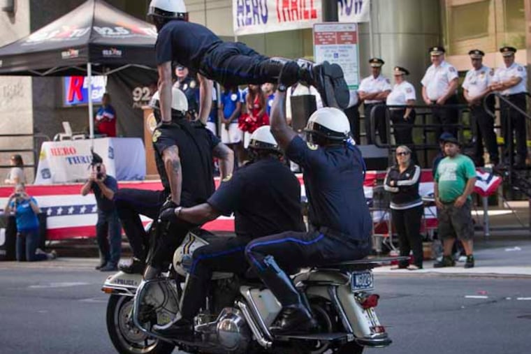 Preview of Hero Thrill Show by Philadelphia Police Highway Patrol Motorcycle Drill Team along Market St. at 19th St. in Center City on Friday, September 12, 2014. This is a preview for the 60th annual Philadelphia Hero Thrill Show taking place Saturday, September 20, 2014. ( ALEJANDRO A. ALVAREZ / STAFF PHOTOGRAPHER )