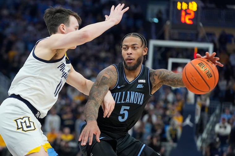 Villanova's Justin Moore tries to get past Marquette's Tyler Kolek during the second half Monday in Milwaukee.