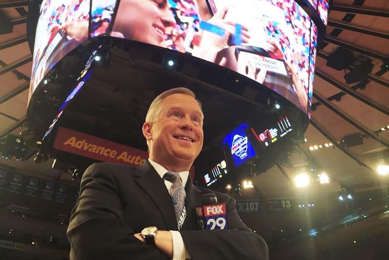 Fox 29 sports director Tom Sredenschek stands on the court after Villanova defeated North Carolina in the NCAA men's basketball championship on April 5, 2016.