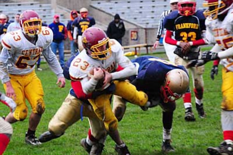 Central High School's Zaim Tahiraj 23 is taken down by Frankford defense during the fourth quarter. Frankford held off Central and won 27 - 6.