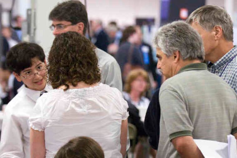 Sixth grader Bryan Freeman of Indian Valley Middle School, Harleysville, explains his project of aerodynamics to judges at the Delaware Valley Science Fairs in Oaks.
