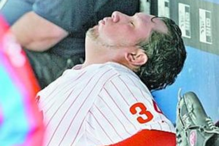 Phillies starter Freddy Garcia slouches in dugout after being relieved by Geoff Geary in 6th inning.