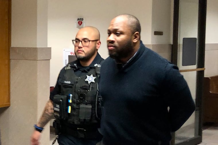 Blair Watts is escorted out of a courtroom in the Montgomery County Courthouse on Wednesday after being sentenced to life in prison for killing Jennifer Brown. As he walked, Watts told reporters he was innocent and promised to fight for his freedom.