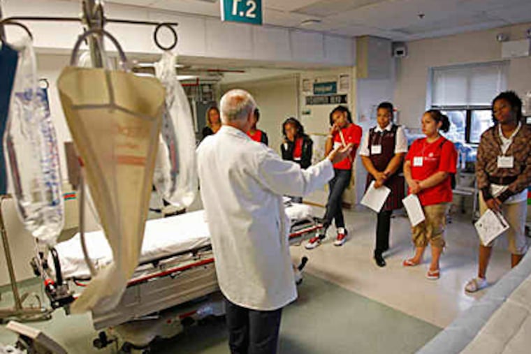 At Cooper University Hospital, trauma nurse David Groves explains his job during the students' visit to the hospital's helipad. (Michael S. Wirtz / Staff photographer)