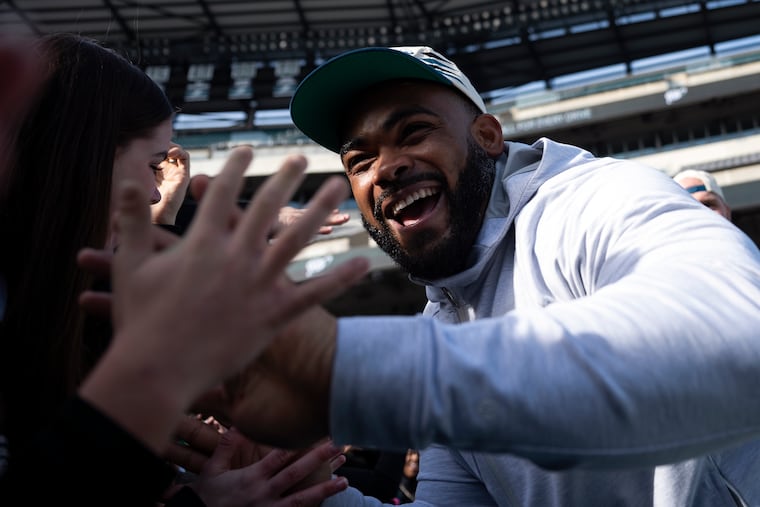 Eagles’ Brandon Graham greets fans during a Super Bowl send-off party at Lincoln Financial Field on Sunday.
