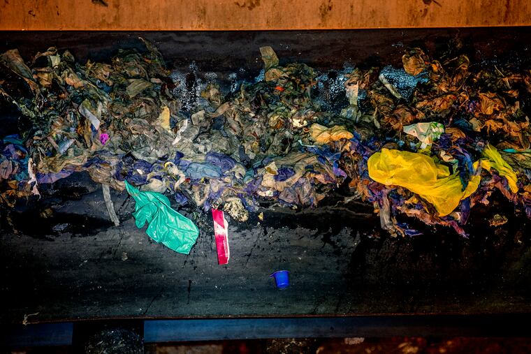 Disinfectant wipes, latex glove, masks, as well as other items screened out by filters as the flow of wastewater enters the Camden County Municipal Utilities Authority (CCMUA) sewage treatment plant on the South Camden Waterfront April 23, 2020. Since the coronavirus, an increased number of the nonflushable items have created clogs, blockages, and other damage to critical infrastructure.