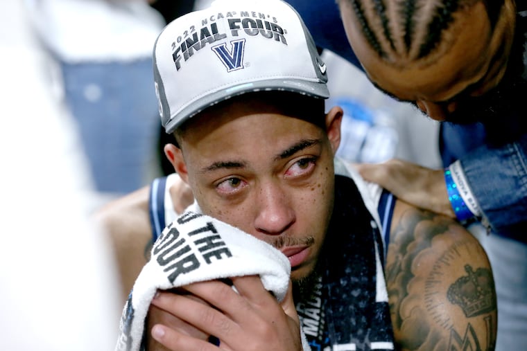 Justin Moore of Villanova suffered a tear in his right Achilles tendon in the final minutes of Saturday’s 50-44 victory over Houston in the South Regional championship game in the NCAA Tournament at AT&T Arena in San Antonio.