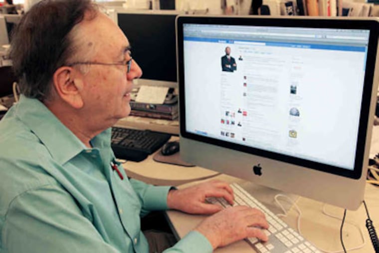Stu Bykofsky, possibly "friend-ing" (probably not) someone on Facebook. (Staff photo)
