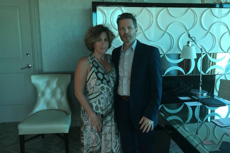 Franco Salerno and Wendy Ianieri, of Warrington, Bucks County. In their room at the Four Seasons hotel, with a view of the fairgrounds.