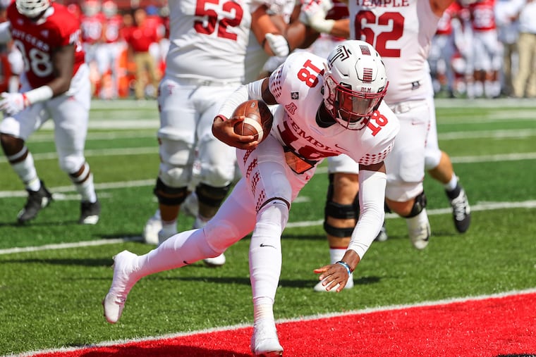 Temple quarterback D'Wan Mathis runs for a touchdown against Rutgers, one of the few highlights for the Owls in their opener.