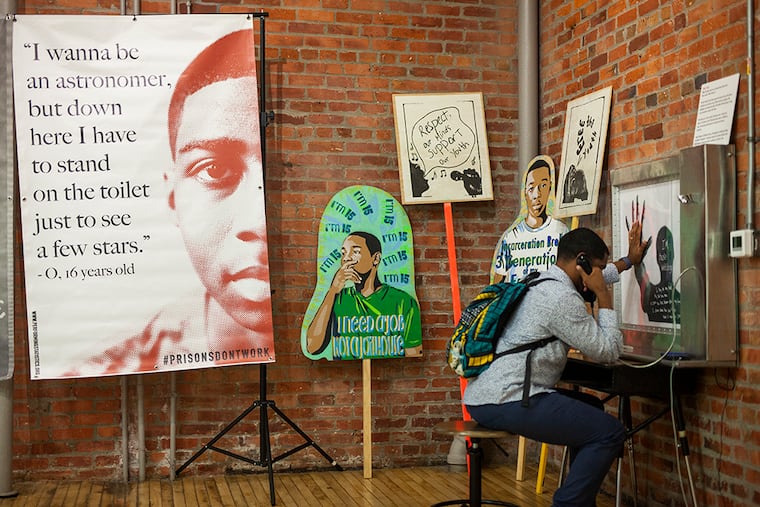 A visitor tours Performing Statistics' Keep Youth Free art exhibit at Philly's Center for Architecture and Design in May, as part of a week of events focused on reimagining our juvenile justice system.