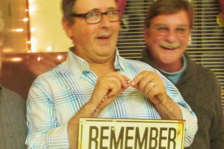 Tony Daley, minus the face paint, drawing a chuckle from his cousin Paul Gerstenfeld.