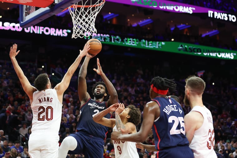 Sixers center Joel Embiid shoots and scores during the first quarter of Tuesday's OT loss to the Cavs at the Wells Fargo Center.