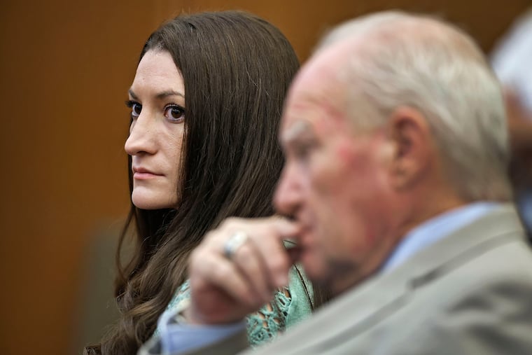 Lindsay Clancy watches jurors enter the courtroom for their second day of deliberations as defense attorney Kevin Reddington sits to her right at Plymouth Superior Court in Plymouth, Mass.