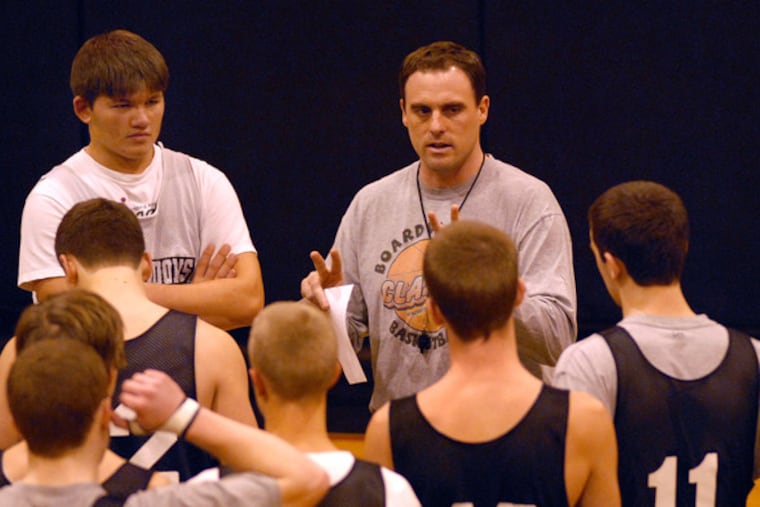 Coach Paul Wiedeman , two years removed from his most recent state championship, works with his players at Haddonfield High.