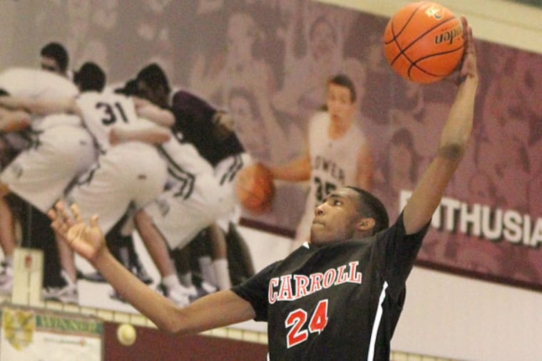 Archbishop Carroll's Derrick Jones goes up for a tomahawk dunk. (Charles Fox/Staff Photographer)