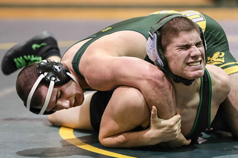 Clearview's Edward Lenkowski, left, wrestles West Deptford's Jarryd
Ley during the 160 lb. weight class match in Mullica Hill, NJ,
Monday, January 5, 2015. Lenkowski won the match 8-0. (Steven M. Falk/Staff Photographer)
