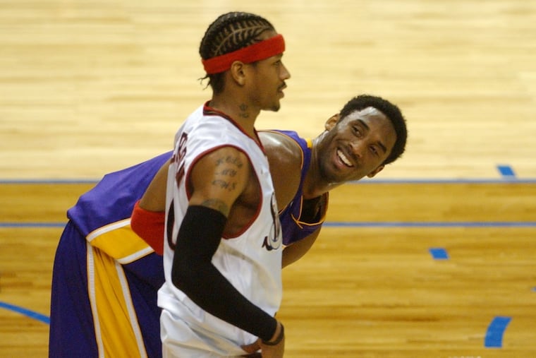 All-Star game MVP and West All-Star Kobe Bryant, right, talks with East All-Star Allen Iverson during the second half of the 2002 NBA All-Star game in Philadelphia. The West team won 135 - 120.