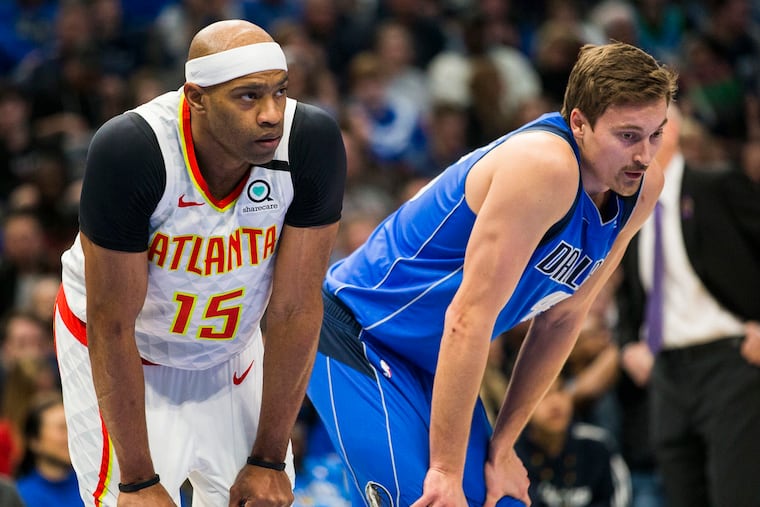 Ryan Broekhoff (right) stands with Atlanta's Vince Carter in February.