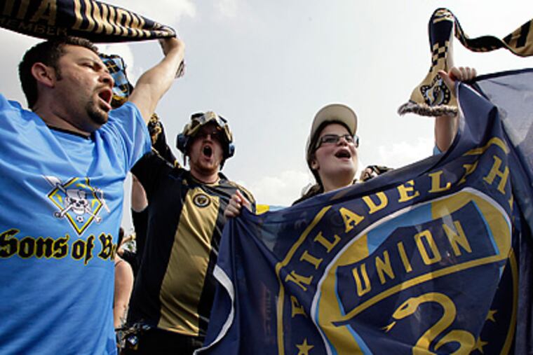 Members of the Sons of Ben dance before the Union play the Seattle Sounders. (Yong Kim / Staff Photographer)