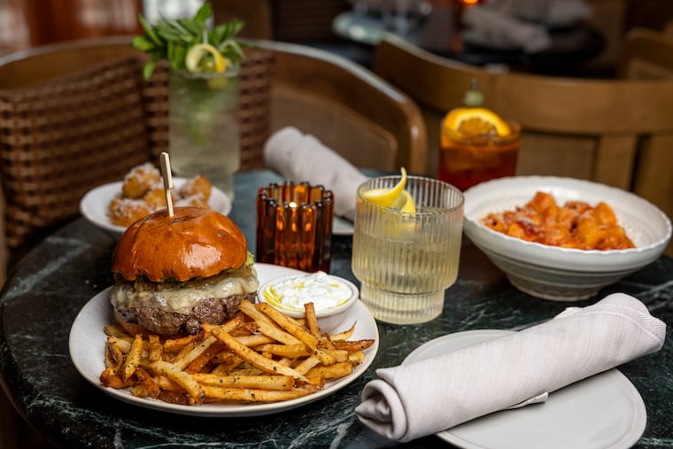 A cheeseburger and fries, the Rigatoni All Amatriciana, and croquettes are all part of the aperitivo menu at Caletta in Fishtown.