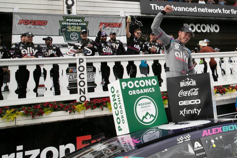Alex Bowman celebrates his win on Victory Lane at Pocono Raceway in Long Pond, Pa., after he triumphed in the first race of a weekend doubleheader.