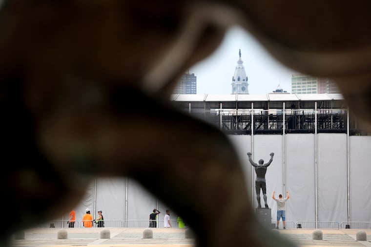 Tourists and workers mix on the steps of the Philadelphia Museum of Art as cleanup continues from the July 4th festivities.