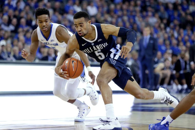 Villanova's Phil Booth got the better of Creighton's Ty-Shon Alexander (left) in the Wildcats' win over the Bluejays in Omaha.