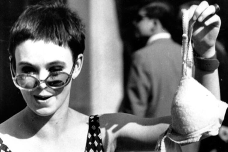 Protester (above) is arrested in Chicago during the tumultuous Democratic National Convention in August 1968, when police and National Guard troops scrapped with demonstrators. At left, a member of the Women's Liberation Party drops a bra into a trash barrel during a protest at the Miss America Pageant in September 1968.