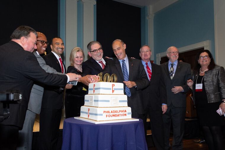 Pedro Ramos, fifth from left, celebrates the Philadelphia Foundation's 100th anniversary with community members.