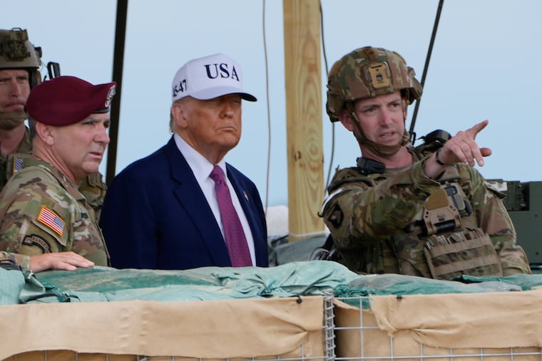 President Donald Trump observes rocket launches and other military demonstrations at Fort Bragg, Tuesday, June 10, 2025, in Fort Bragg, N.C.