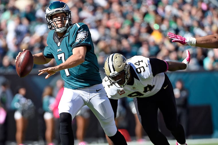 Philadelphia Eagles quarterback Sam Bradford (7) scrambles away form New Orleans Saints defensive end Cameron Jordan (94) during the second quarter at Lincoln Financial Field.