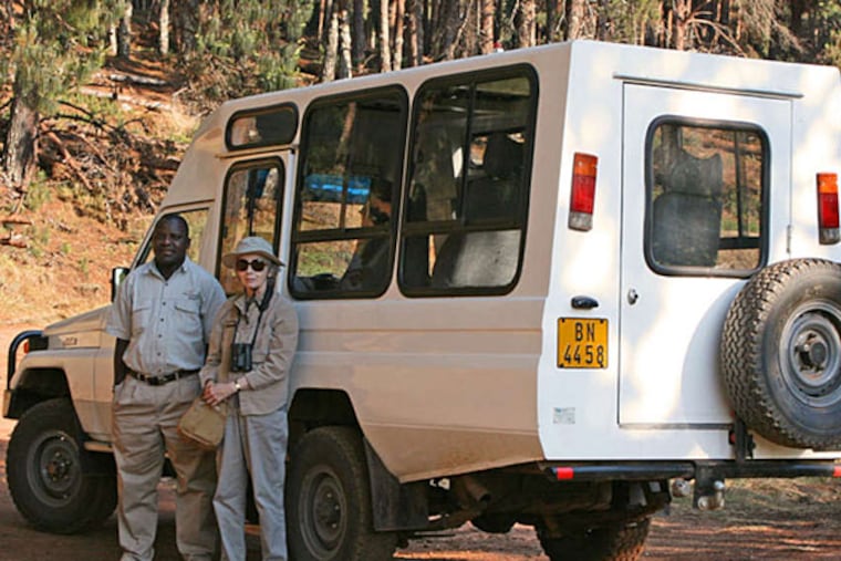 Ann Howell and guide Abasi Jana in Malawi. Howell's husband says he likes the independence of having a private guide. (THOMAS HOWELL)