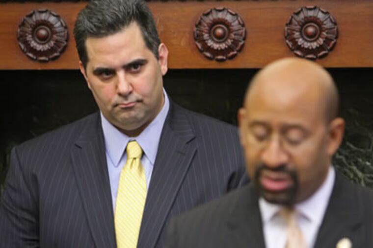 Richard Negrin, interim executive director of the BRT, left, stands behind Mayor Nutter, right, after a moratorium was ordered on property assessments in January. (Michael Bryant / Staff Photographer)