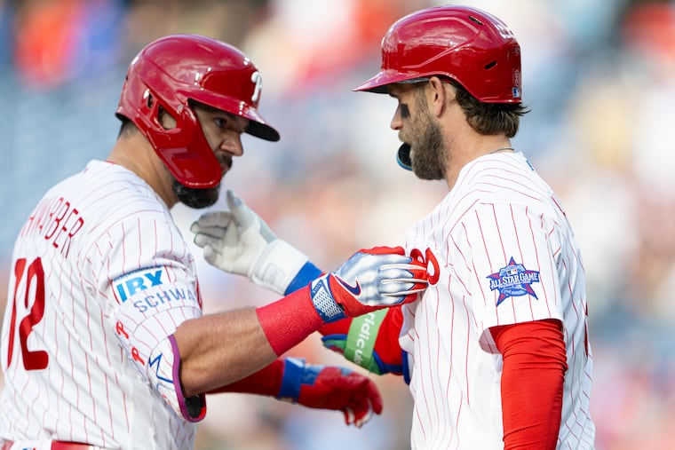 Kyle Schwarber (left) and Bryce Harper have been off to a hot start this season. Harper has 12 homers while Schwarber has 20.