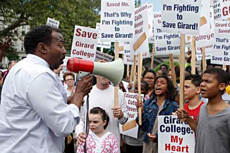 Bernard Oliver, an graduate of the Class of 1978, speaks at a rally outside of Gerard College on Friday, after the last day of school for students. Students, parents and alumni came together to rally to voice their concerns about plans to temporarily end the boarding and high school programs in 2014. (LUKE RAFFERTY/Staff Photographer).