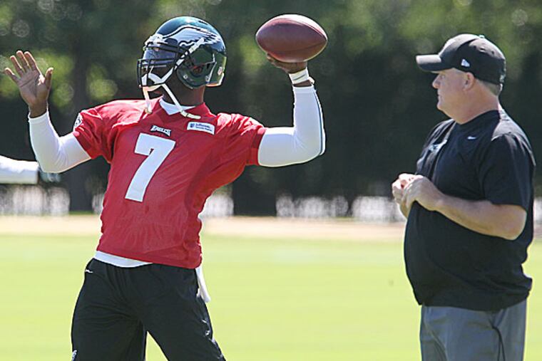 Eagles quarterback Michael Vick and head coach Chip Kelly. (Charles Fox/Staff Photographer)